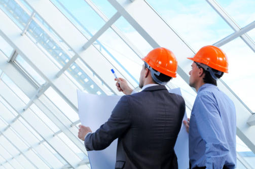 20706852 - two men in hard hats at construction site